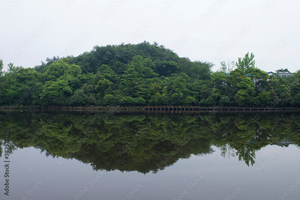 small hill reflection in the lake small hill reflection in the lake