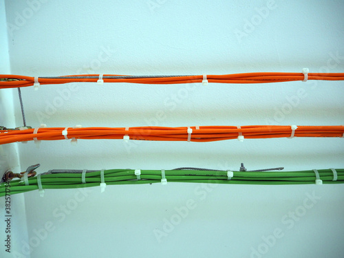 Fiber optic cable along the wall