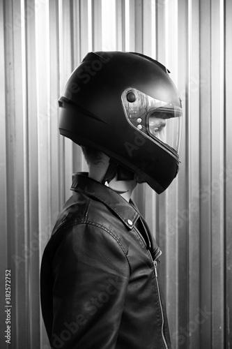 Side view of motorcyclist in helmet photo
