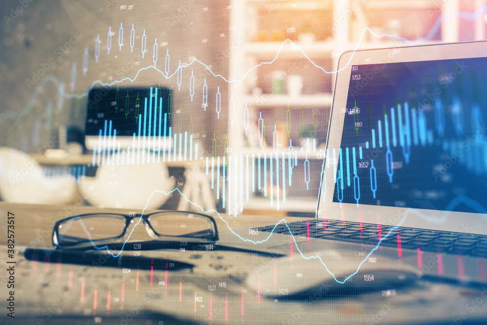 Forex market graph hologram and personal computer on background. Multi exposure. Concept of investment. Forex market graph hologram and personal computer on background. Multi exposure. Concept of investment.