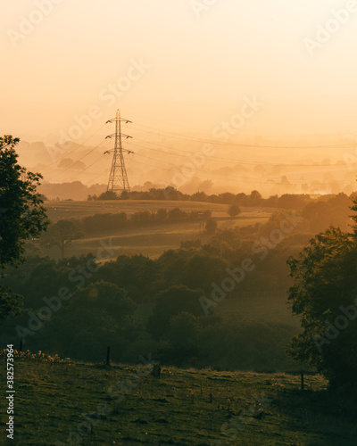 Power Lines in rural land at Sunset photo