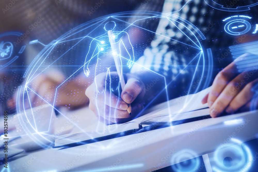 Man's hands working with notes background. Modern computer record diagram with virtual mnitor. Man's hands working with notes background. Modern computer record diagram with virtual mnitor.