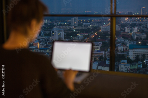 Woman working from her laptop at home photo