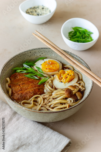 Ramen soup with noodles, pork, mushrooms and eggs. Japanese cuisine. Recipe.