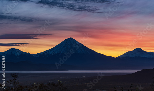 Kamchatka, sunrise over the Koryaksky and Avachinsky volcanoes © Alexander