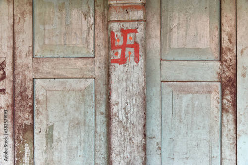 Swastika painted on a wooden door