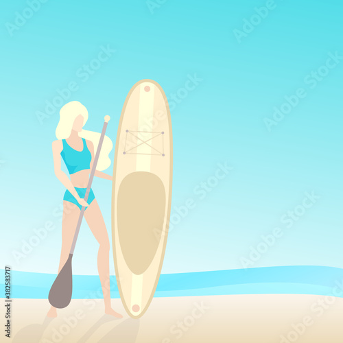 Girl with sup board and paddle on the beach