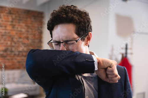 Man coughing in the office