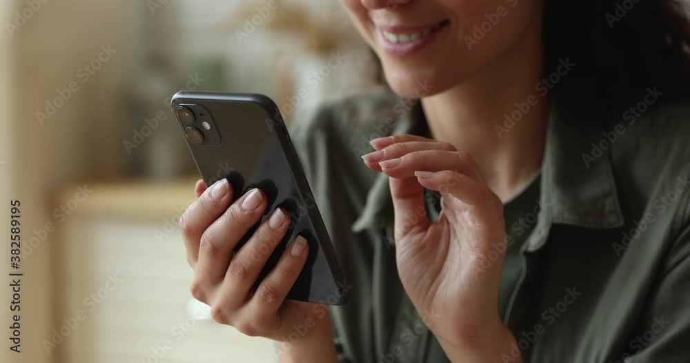 Close up female hands holding smart phone enjoy free time scroll news feed, choose goods on-line, buying on internet, watching photos. Easy and comfortable usage of modern wireless technology concept Close up female hands holding smart phone enjoy free time scroll news feed, choose goods on-line, buying on internet, watching photos. Easy and comfortable usage of modern wireless technology concept