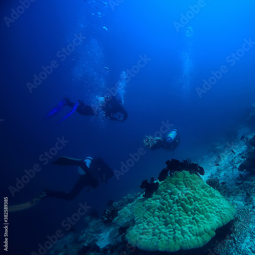 diver breathes air under water bubbles  releases gas  landscape underwater depth