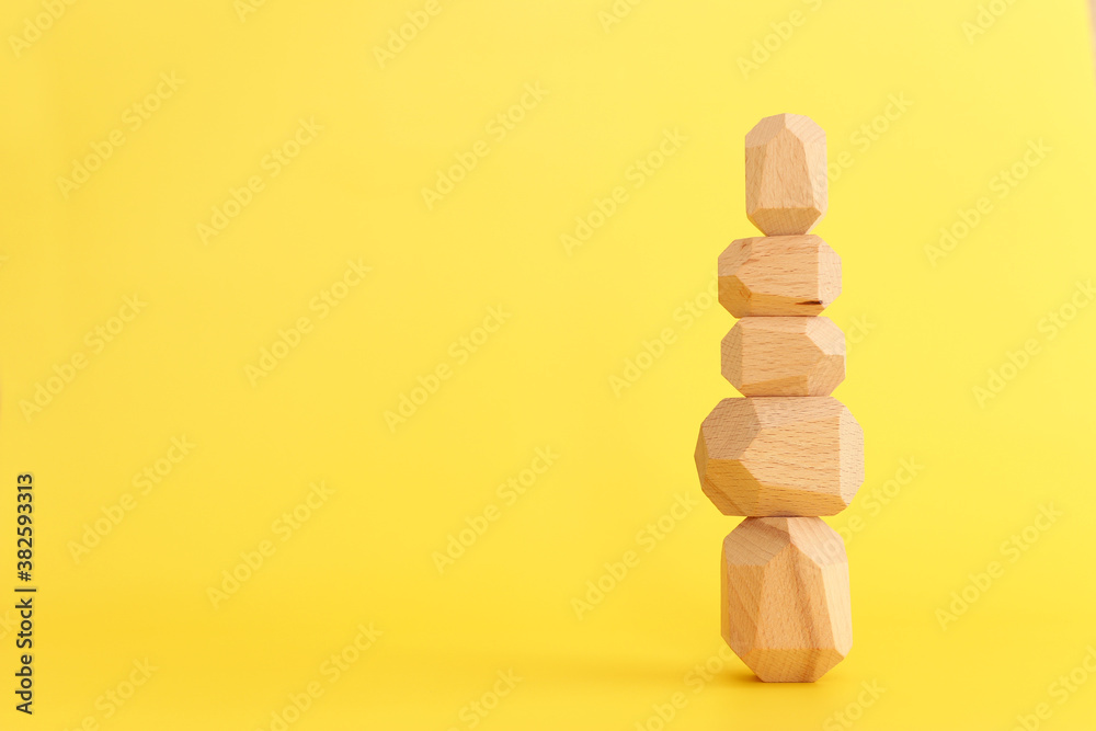 finding the rifht balance. image of stacked wooden cubes finding the rifht balance. image of stacked wooden cubes