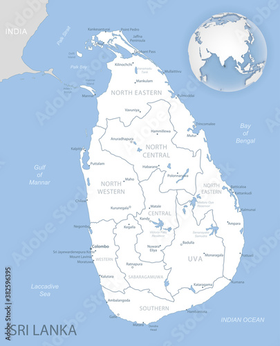 Blue-gray detailed map of Sri Lanka administrative divisions and location on the globe.