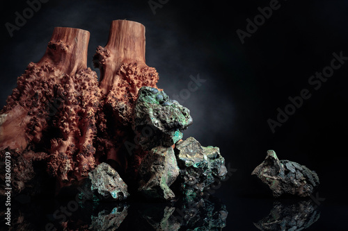 Stones and wood on a black background.