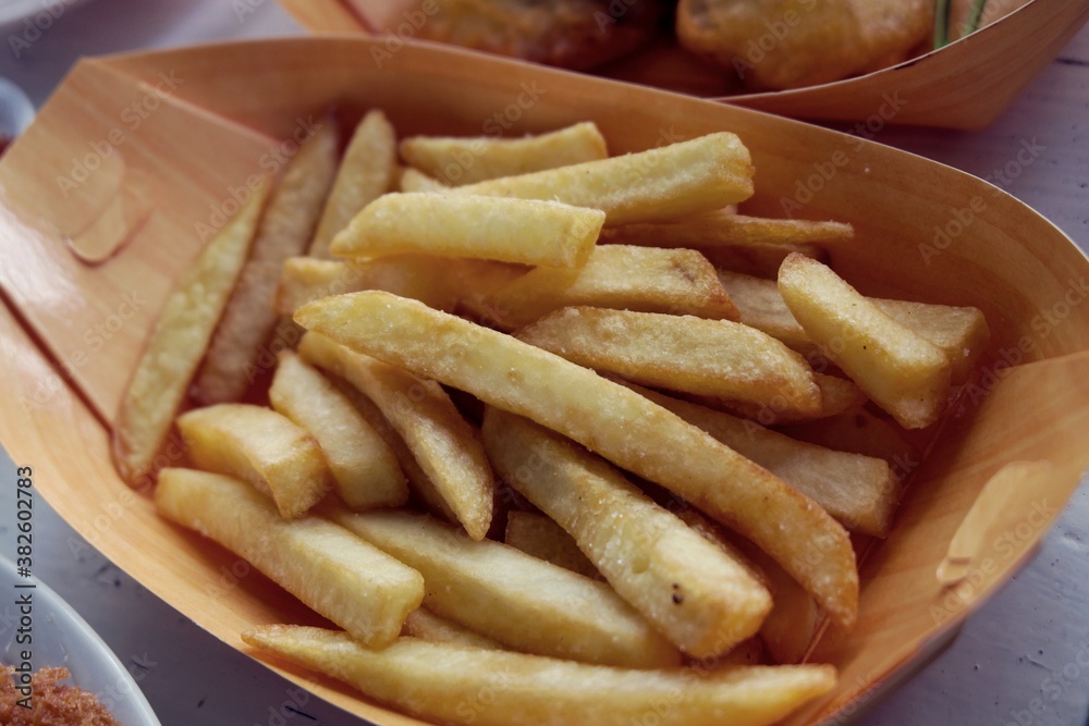 French fries in carton in kraft blank paper fry box French fries in carton in kraft blank paper fry box