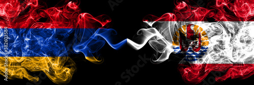 Armenia vs French Polynesia smoky mystic flags placed side by side. Thick colored silky abstract smoke flags