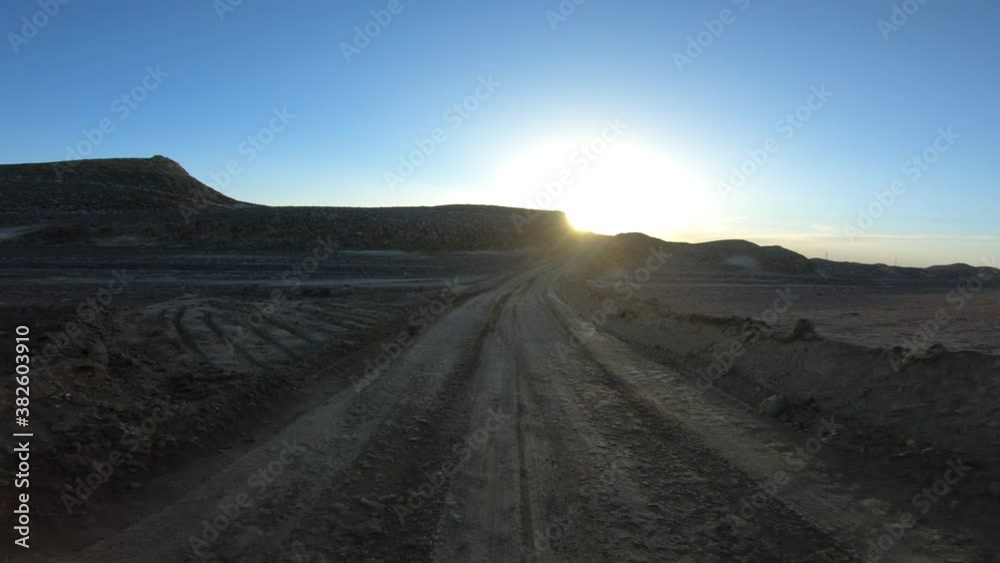 Running in the sunset yardang landform aera in China Running in the sunset yardang landform aera in China