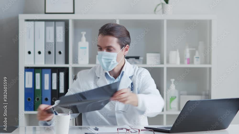Professional medical doctor working in hospital office using computer. Professional medical doctor working in hospital office using computer.