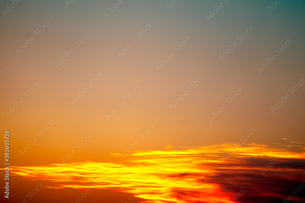Sky at sunset with bright orange clouds