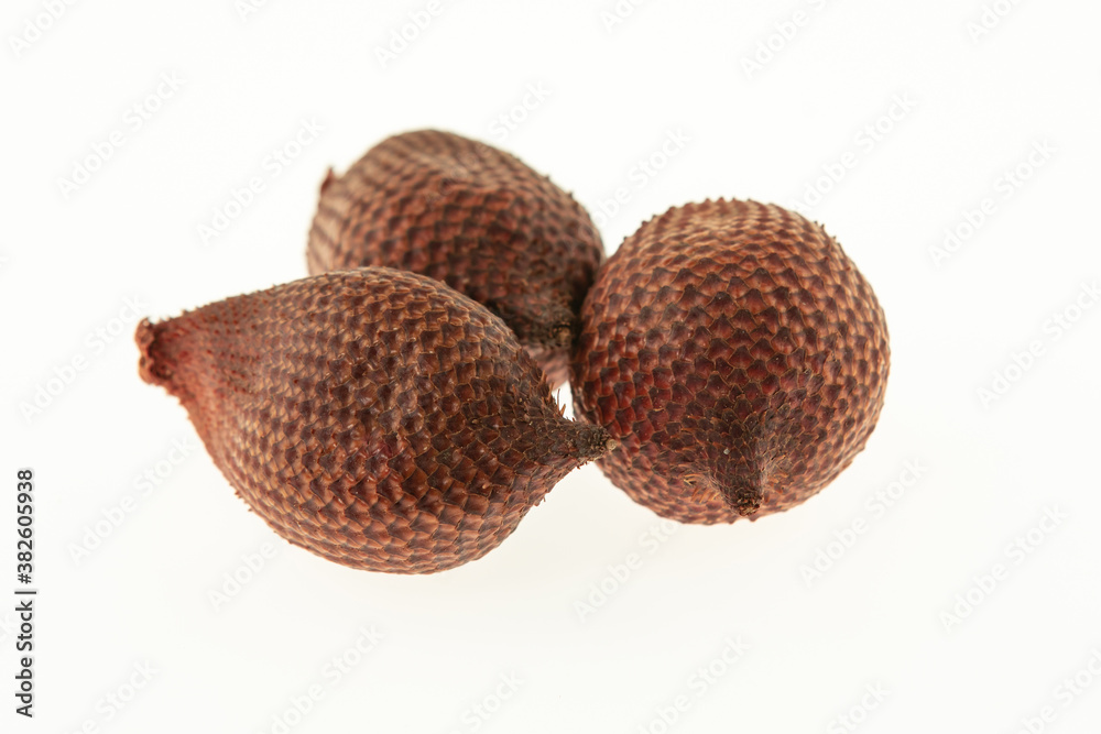 herring three tropical dragon fruit dark brown and rough closeup on a white background herring three tropical dragon fruit dark brown and rough closeup on a white background