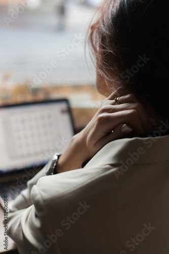Young beautiful woman connecting with her computer (ID: 382606584)