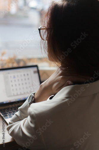 Young beautiful woman connecting with her computer (ID: 382606585)