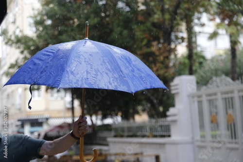 A rainy day and a blue umbrella