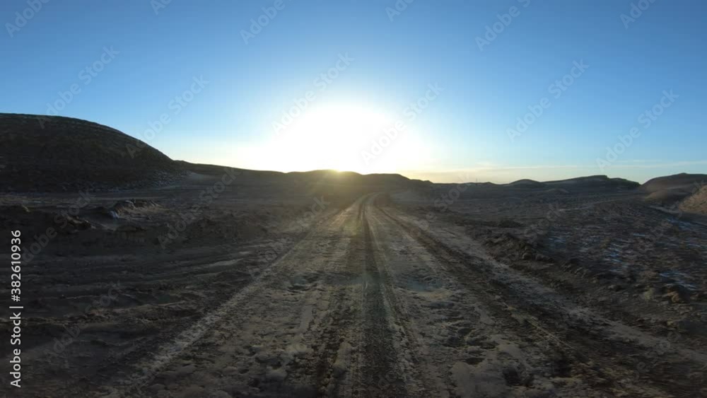 Running in the sunset yardang landform aera in China Running in the sunset yardang landform aera in China