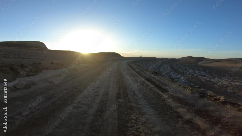 Running in the sunset yardang landform aera in China Running in the sunset yardang landform aera in China