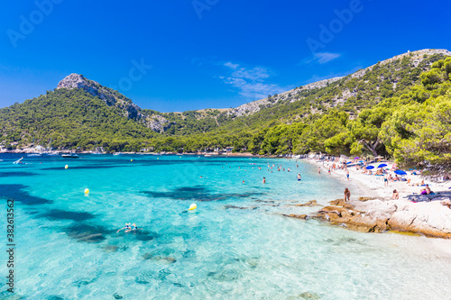 Fototapeta Naklejka Na Ścianę i Meble -  Platja de Formentor, Mallorca, Spain - July 20, 2020: People enjoying popular beach in summer, Mallorca, Spain.