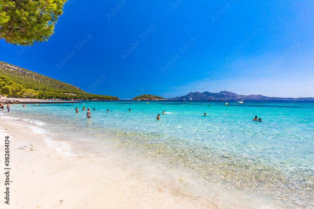 Fototapeta premium Platja de Formentor, Mallorca, Spain - July 20, 2020: People enjoying popular beach in summer, Mallorca, Spain.