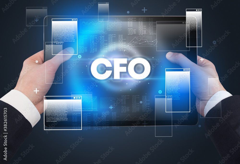Close-up of a hand holding tablet with CFO abbreviation, modern technology concept Close-up of a hand holding tablet with CFO abbreviation, modern technology concept