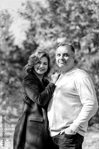 black white vertical photo of middle-aged men and women