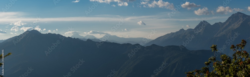 Panorama of the mountain range in the distance. Landscape in the haze