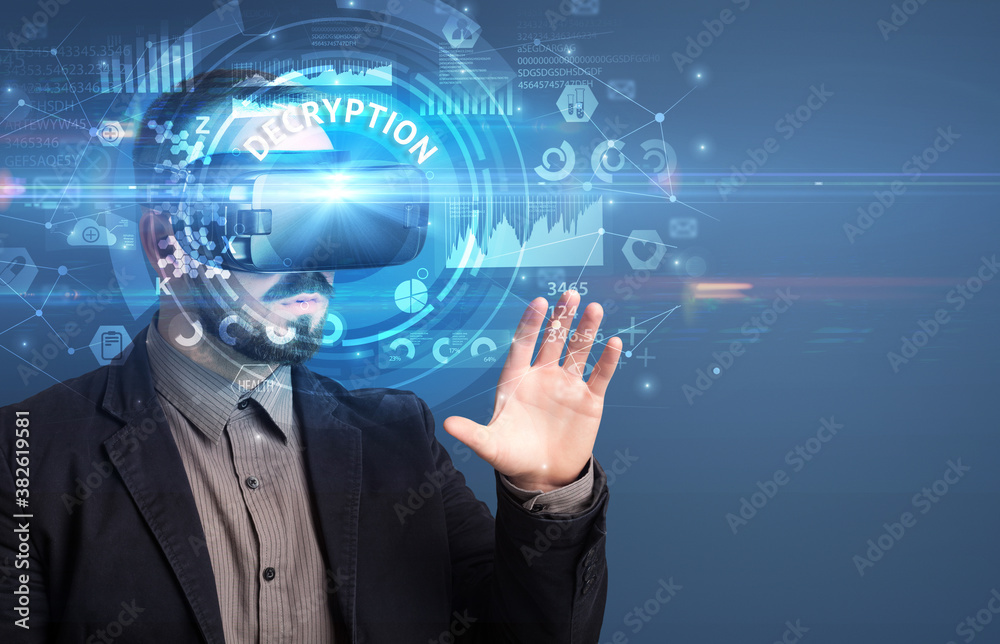 Businessman looking through Virtual Reality glasses with DECRYPTION inscription, innovative technology concept Businessman looking through Virtual Reality glasses with DECRYPTION inscription, innovative technology concept