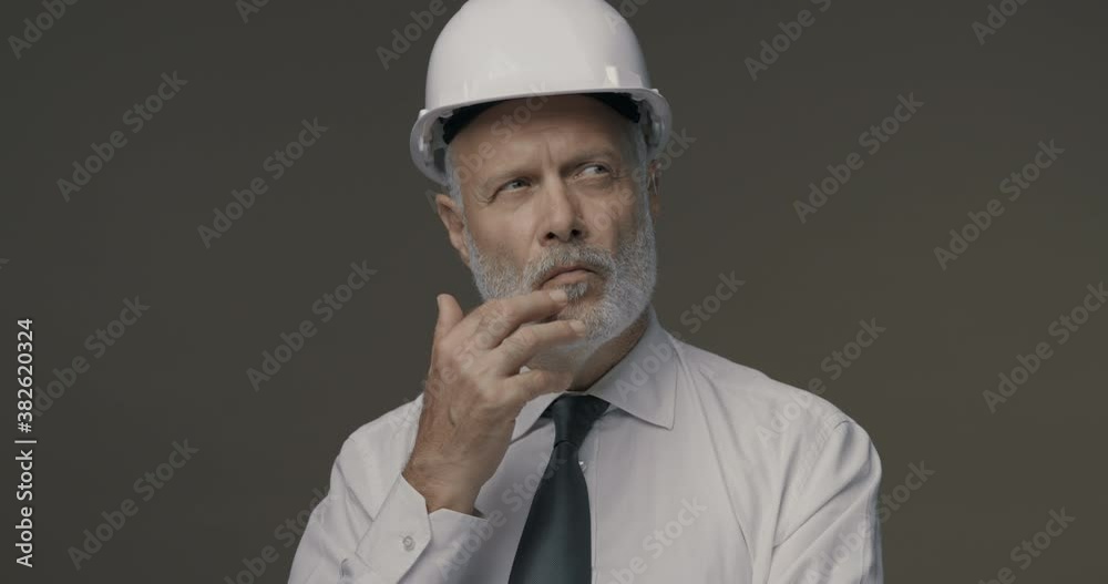Pensive businessman thinking with hand on chin Pensive businessman thinking with hand on chin