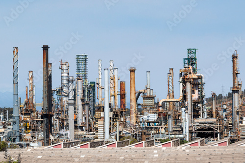 Chimneys of a factory in Chile seen from the outside with the blue and gray sky.