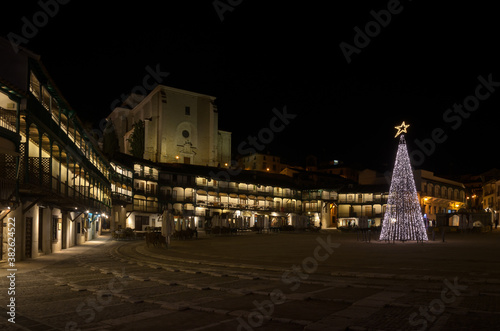 Main square of Chinchón illuminated on a Christmas night, Madrid, Spain