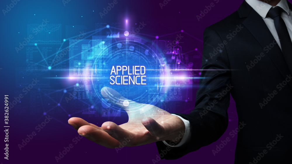 Man hand holding APPLIED SCIENCE inscription, technology concept Man hand holding APPLIED SCIENCE inscription, technology concept