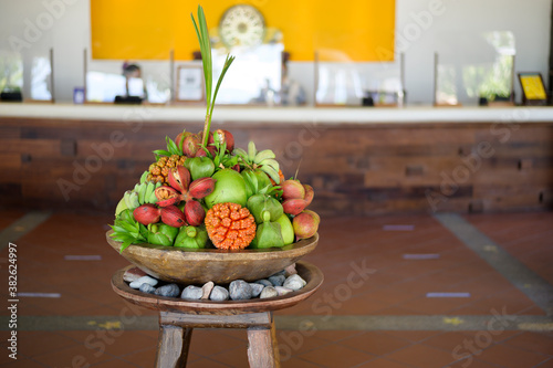 View of various exotic fruit presented at reception desk of hotle. photo