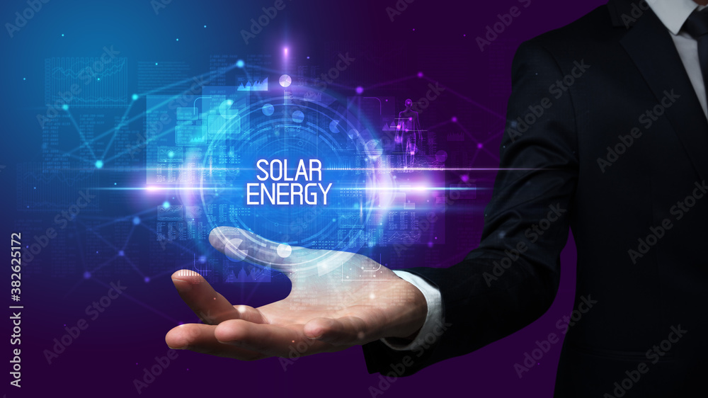 Obraz premium Man hand holding SOLAR ENERGY inscription, technology concept