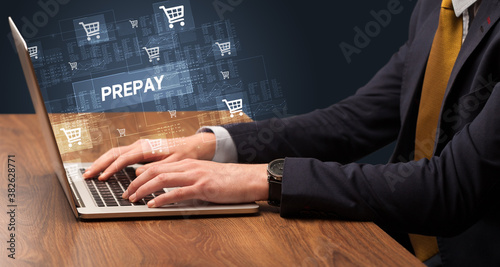 Wallpaper Mural Businessman working on laptop with PREPAY inscription, online shopping concept Torontodigital.ca