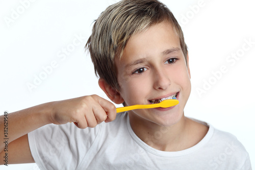Young boy brushing his teeth