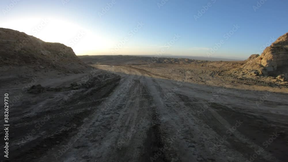 Running in the sunset yardang landform aera in China Running in the sunset yardang landform aera in China