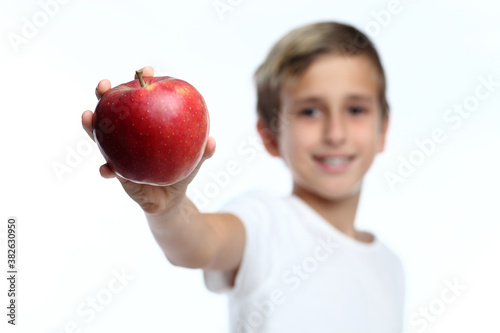 Boy holding an apple photo