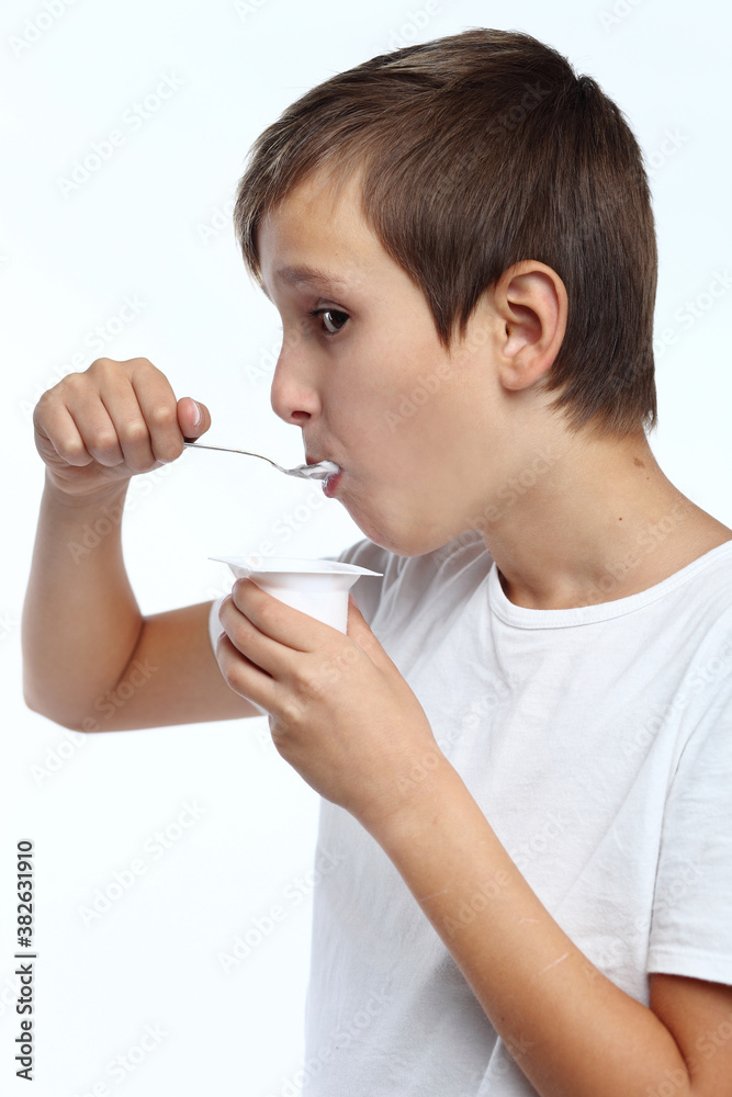 Healthy happy boy eating yogurt Healthy happy boy eating yogurt