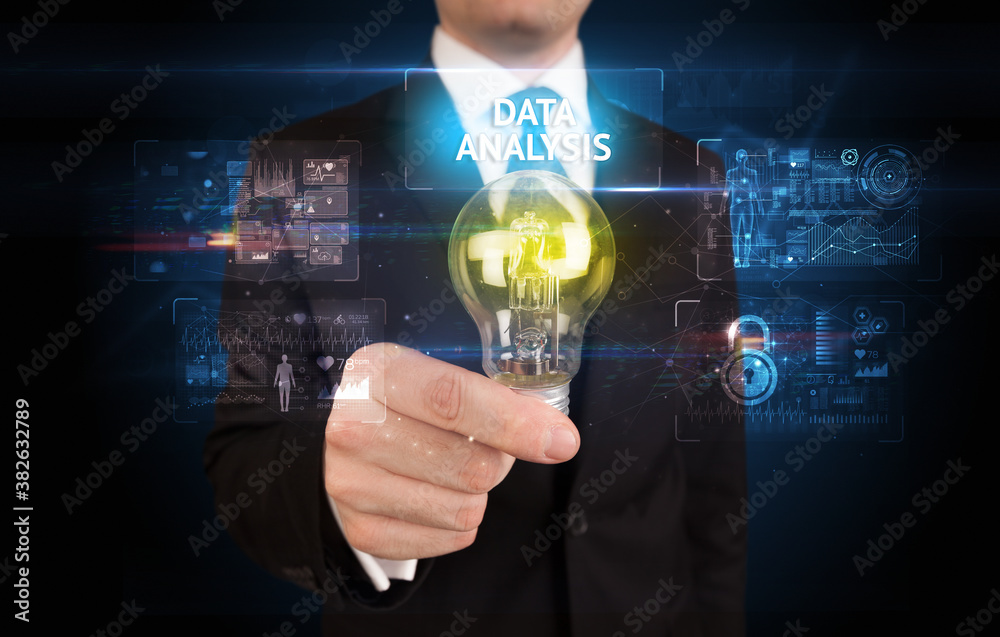 Businessman holding lightbulb with DATA ANALYSIS inscription, online security idea concept Businessman holding lightbulb with DATA ANALYSIS inscription, online security idea concept