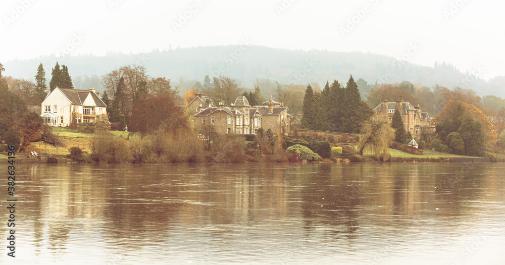 Fototapeta premium Perth, Scotland - 24 November 2019: old stone built houses along the river