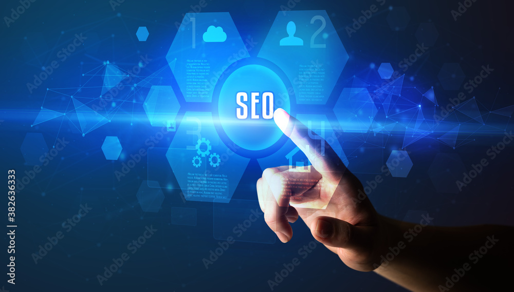 Hand touching SEO inscription, new technology concept Hand touching SEO inscription, new technology concept