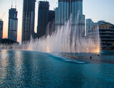 Famous, dancing, Dubai fountain, with Burj Khalifa on foreground, tallest building in the world UAE.