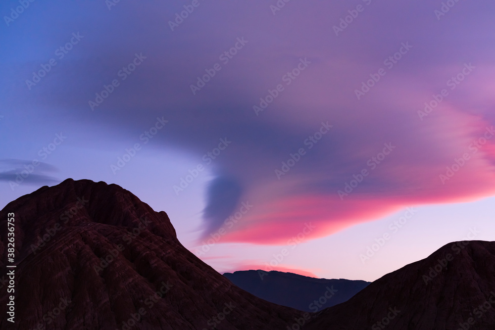 Sunset clouds in the Devil's Desert in the Los Colorados area, in the town of Tolar Grande in the province of Salta in La Puna Argentina. Argentina, South America, America Sunset clouds in the Devil's Desert in the Los Colorados area, in the town of Tolar Grande in the province of Salta in La Puna Argentina. Argentina, South America, America